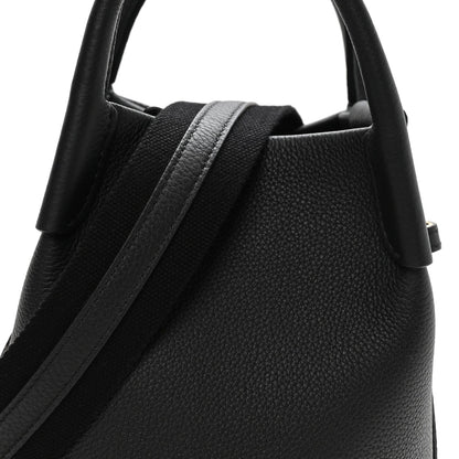 Black grained calfskin micro bale bag with top handle and strap detail
