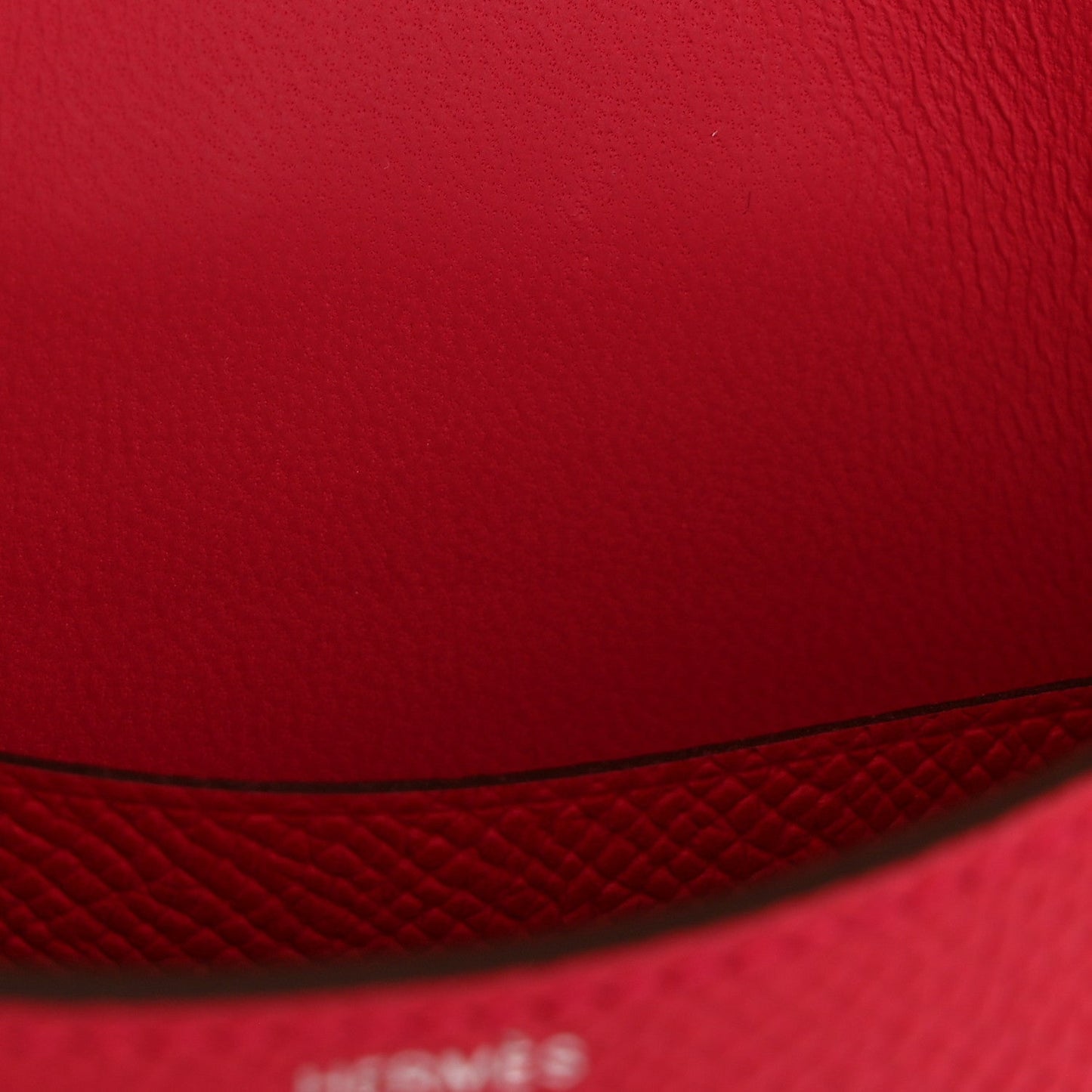 Hermes slim wallet rose red leather closeup with seam and edge stitching