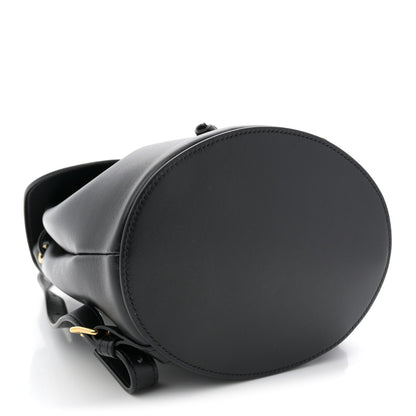 Celine Triomphe calfskin Bonnie backpack side view in black with round base.