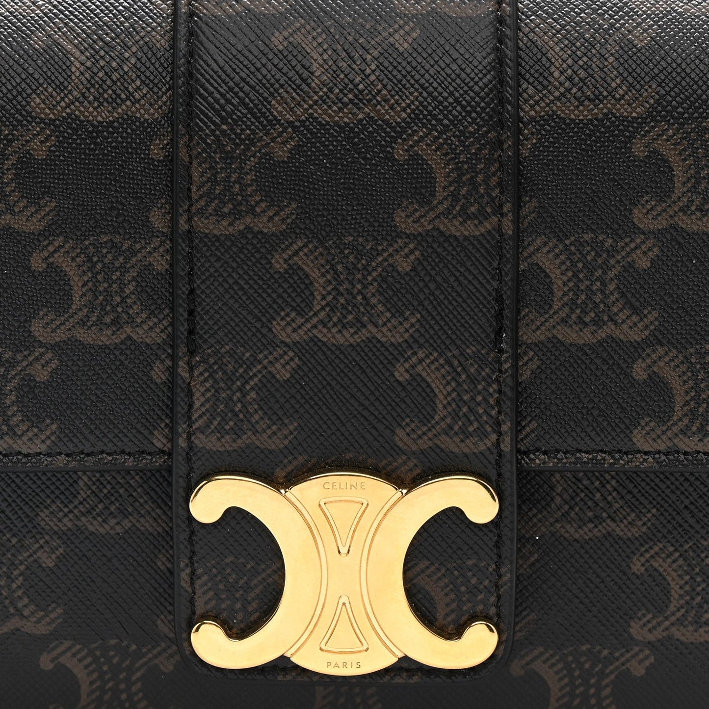 Celine Triomphe shoulder bag front close-up with gold CD clasp on dark brown canvas