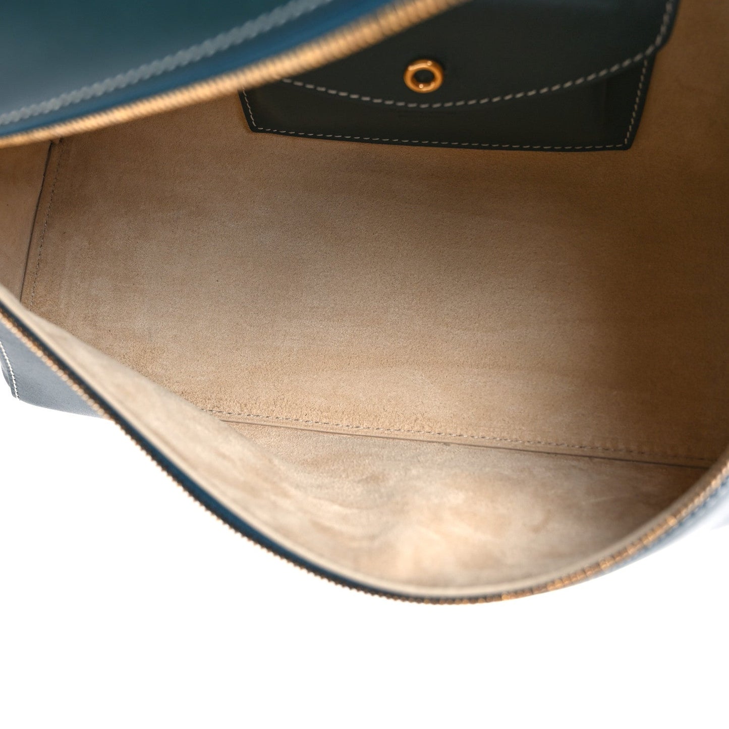 Petrolio teal leather bag interior with stitched lining and side panel