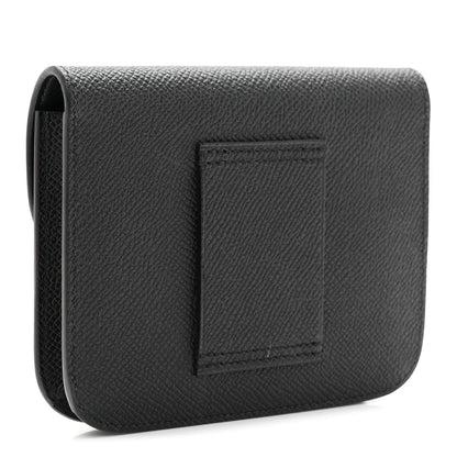Black leather slim wallet with embossed square panel on back.