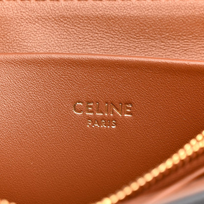 Celine Triomphe shoulder bag close-up of tan interior leather with “CELINE PARIS” stamp