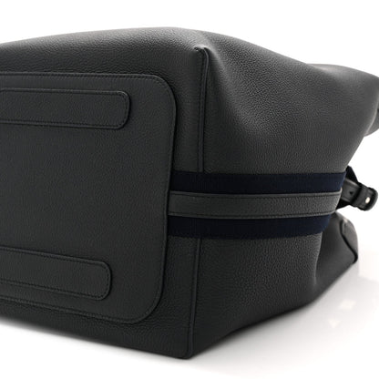 Dark navy leather flap panel with seam details and adjustable crossbody strap