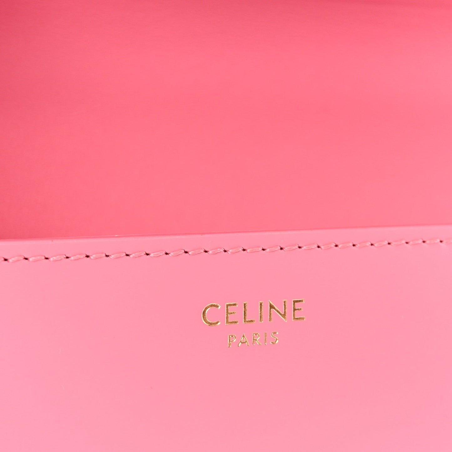 Flamingo pink leather back panel with 'CELINE PARIS' gold stamp