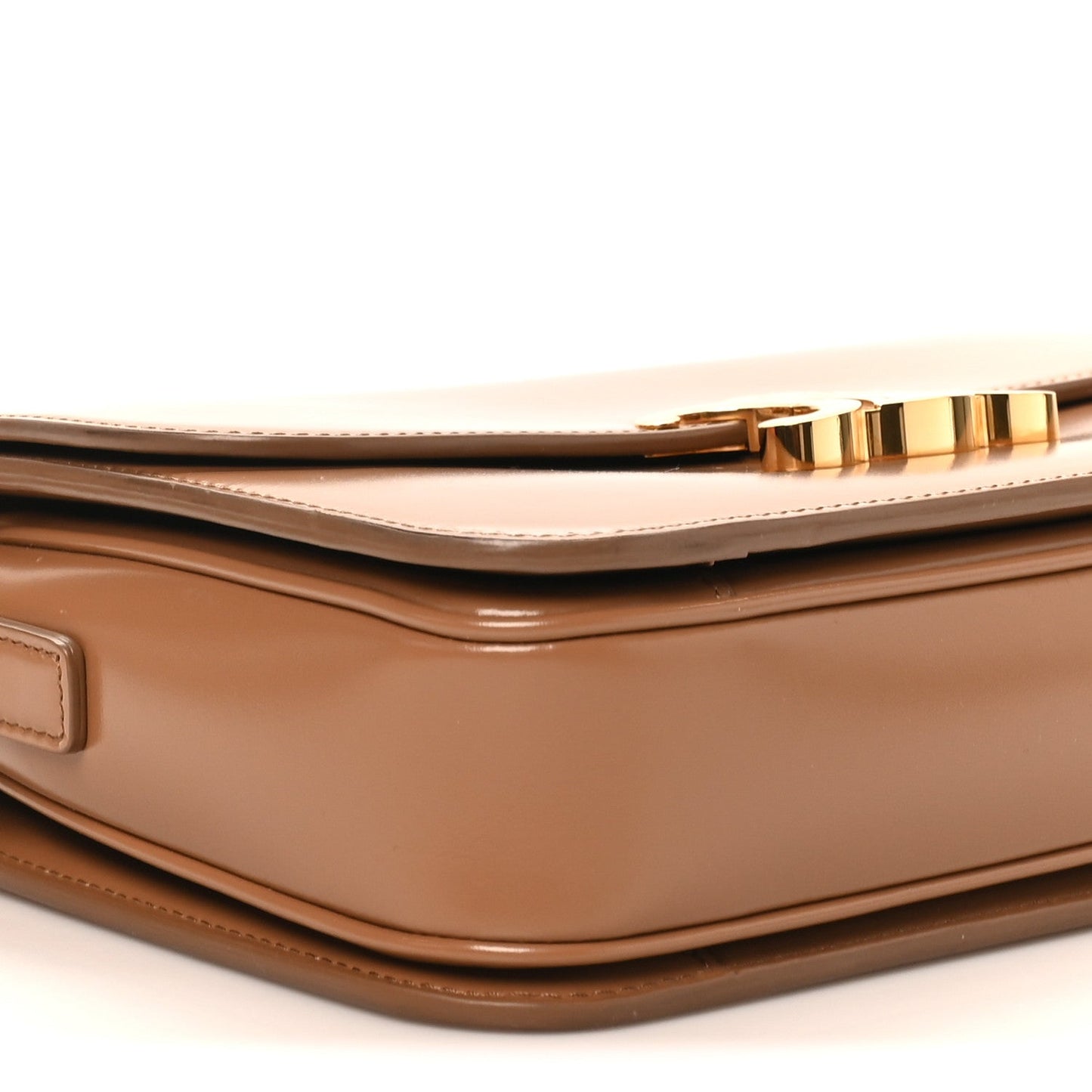 Bronze flap and top seam with gold-tone zipper trim