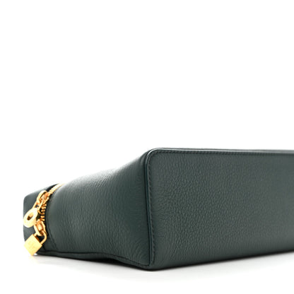 Dark green grained leather pouch with front corner seam and gold zipper pull detail.