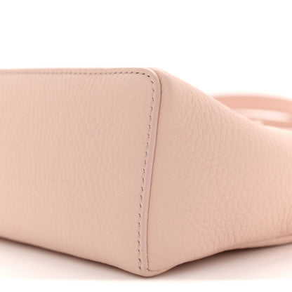 Light pink grained leather base corner with stitched seam