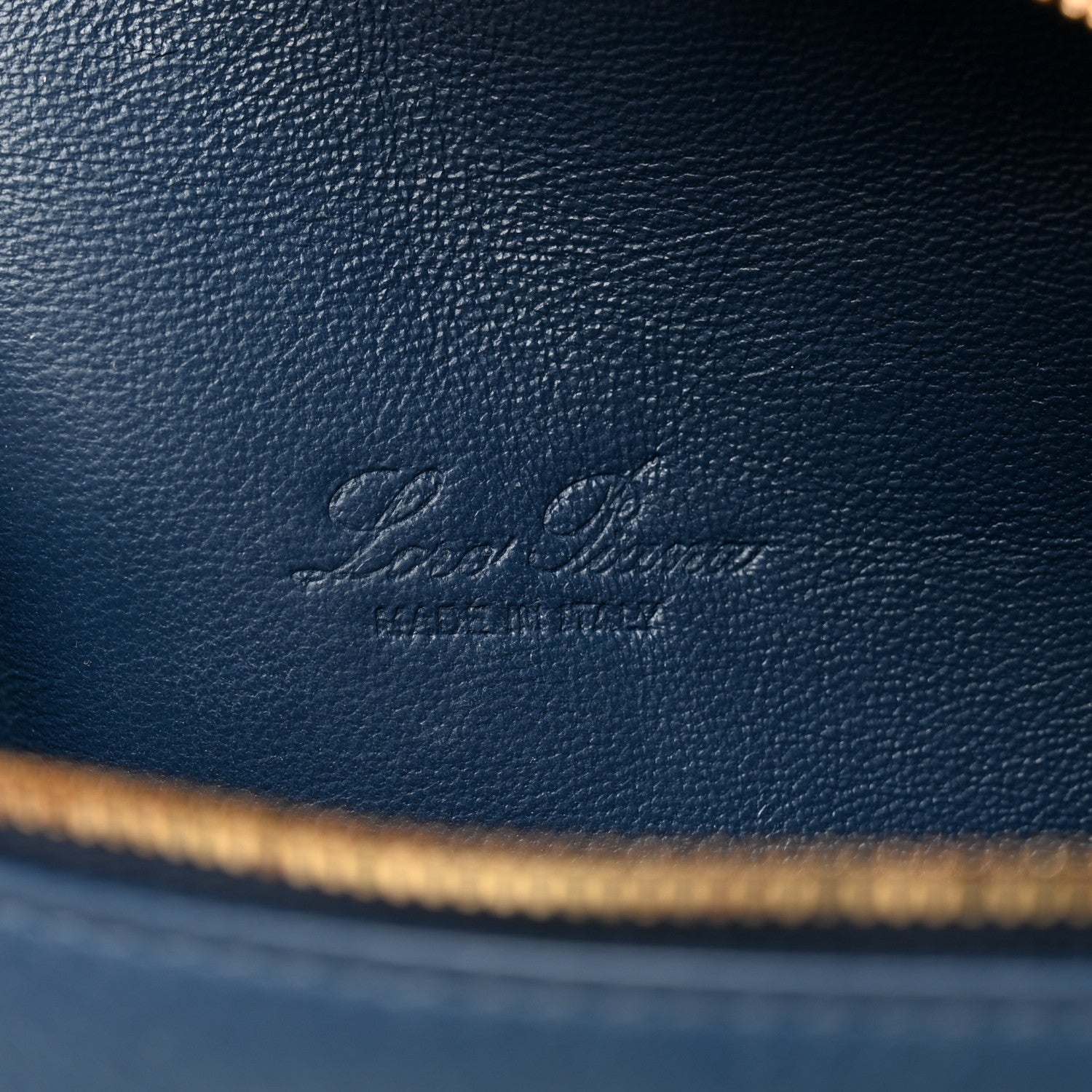 Loro Piana embossed logo on navy grained calfskin with gold zipper trim