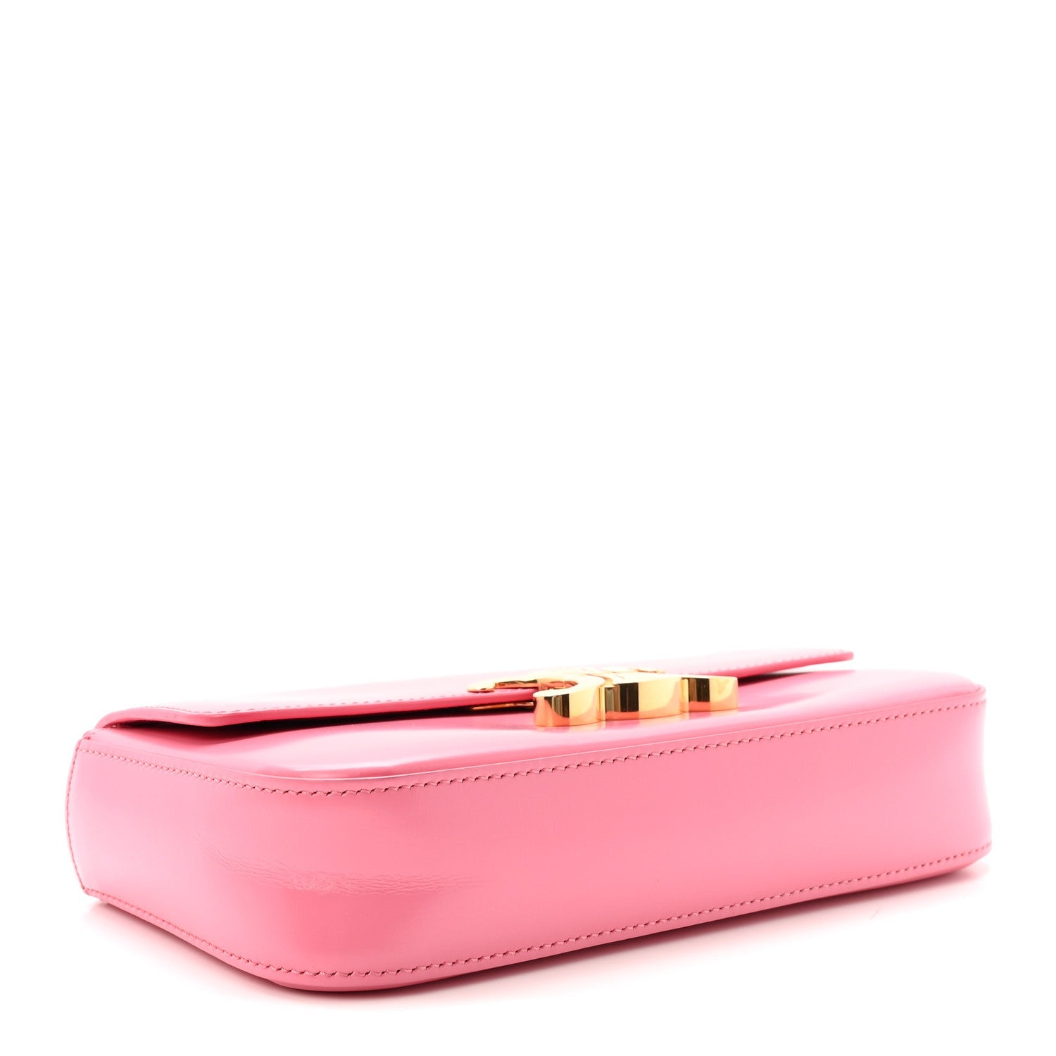 Flamingo pink leather shoulder bag with gold turn-lock bar at the top