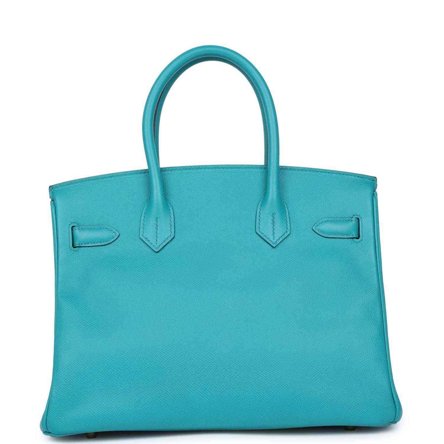 Elegant turquoise leather tote bag with timeless, sophisticated design and refined details.