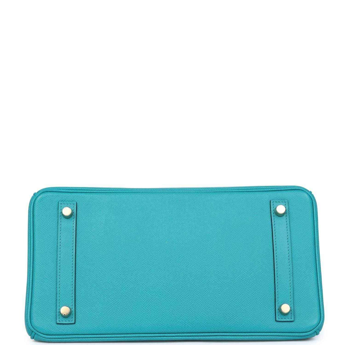 Timeless turquoise leather handbag base with gold accents, sophisticated and elegant style.