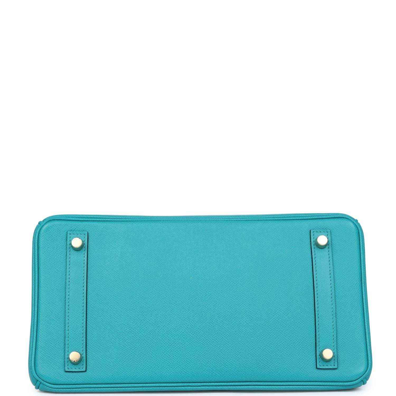Timeless turquoise leather handbag base with gold accents, sophisticated and elegant style.