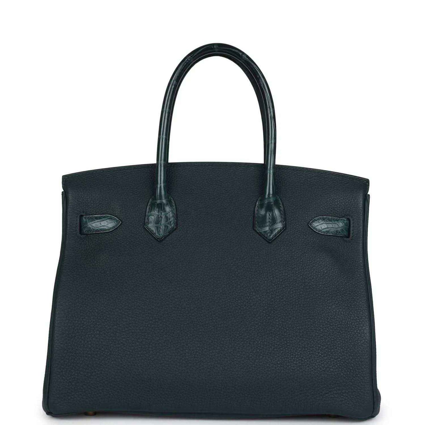 Elegant black leather handbag with textured finish and sophisticated structured silhouette.