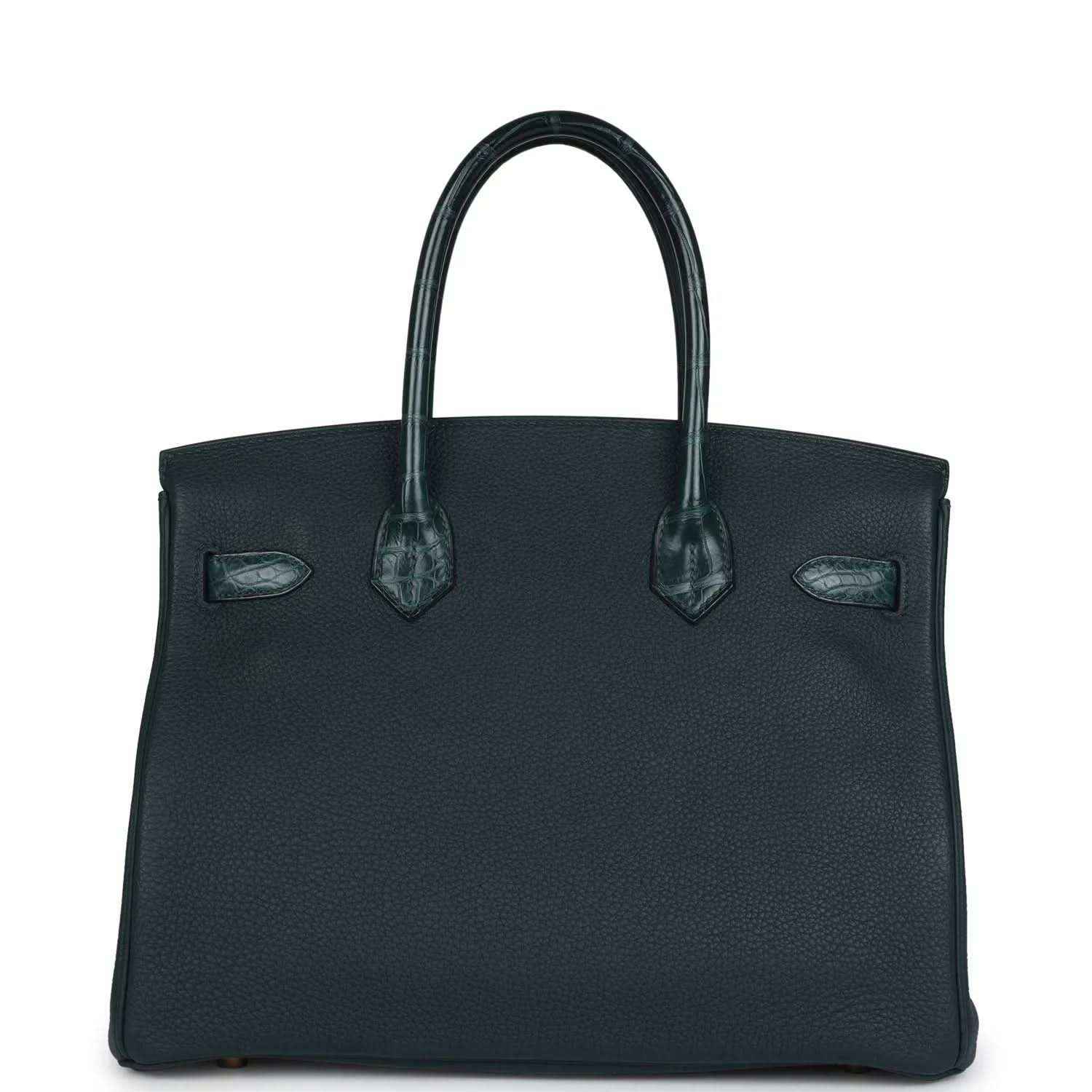 Elegant black leather handbag with textured finish and sophisticated structured silhouette.