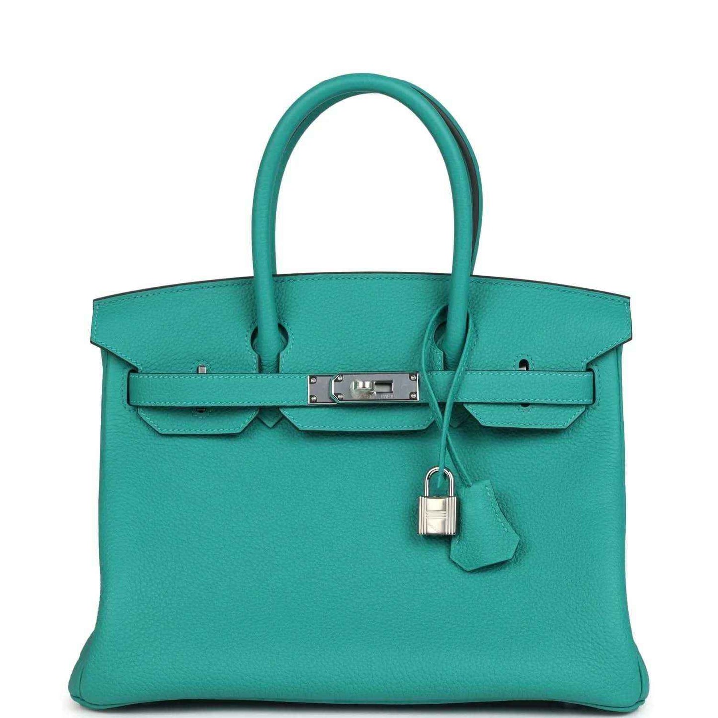 Elegant turquoise leather handbag with structured silhouette and silver hardware, timeless style.