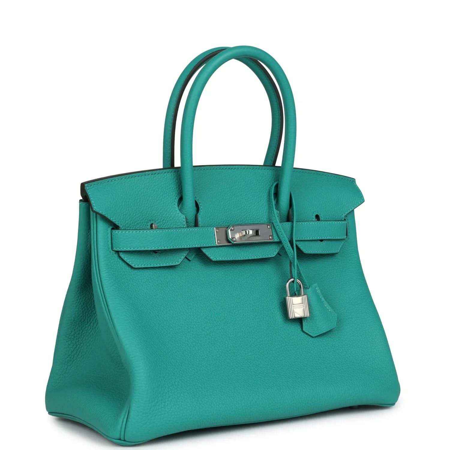 Elegant turquoise leather handbag with silver hardware and top handles, timeless and sophisticated