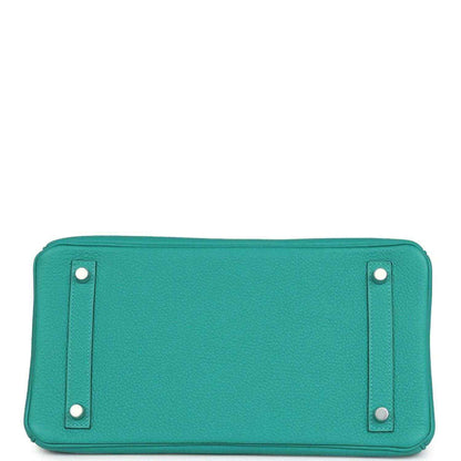 Timeless, elegant turquoise leather handbag base with refined silver-tone hardware.
