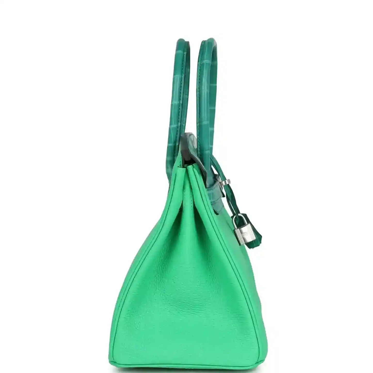 Elegant green leather handbag with structured silhouette and sophisticated double handles