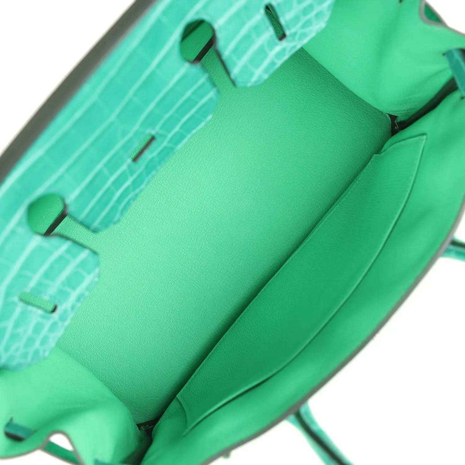 Elegant green leather tote bag interior with spacious, timeless and sophisticated design