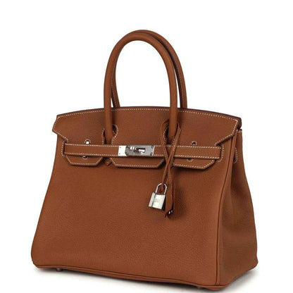 Timeless, elegant brown leather handbag with silver hardware and sophisticated details.