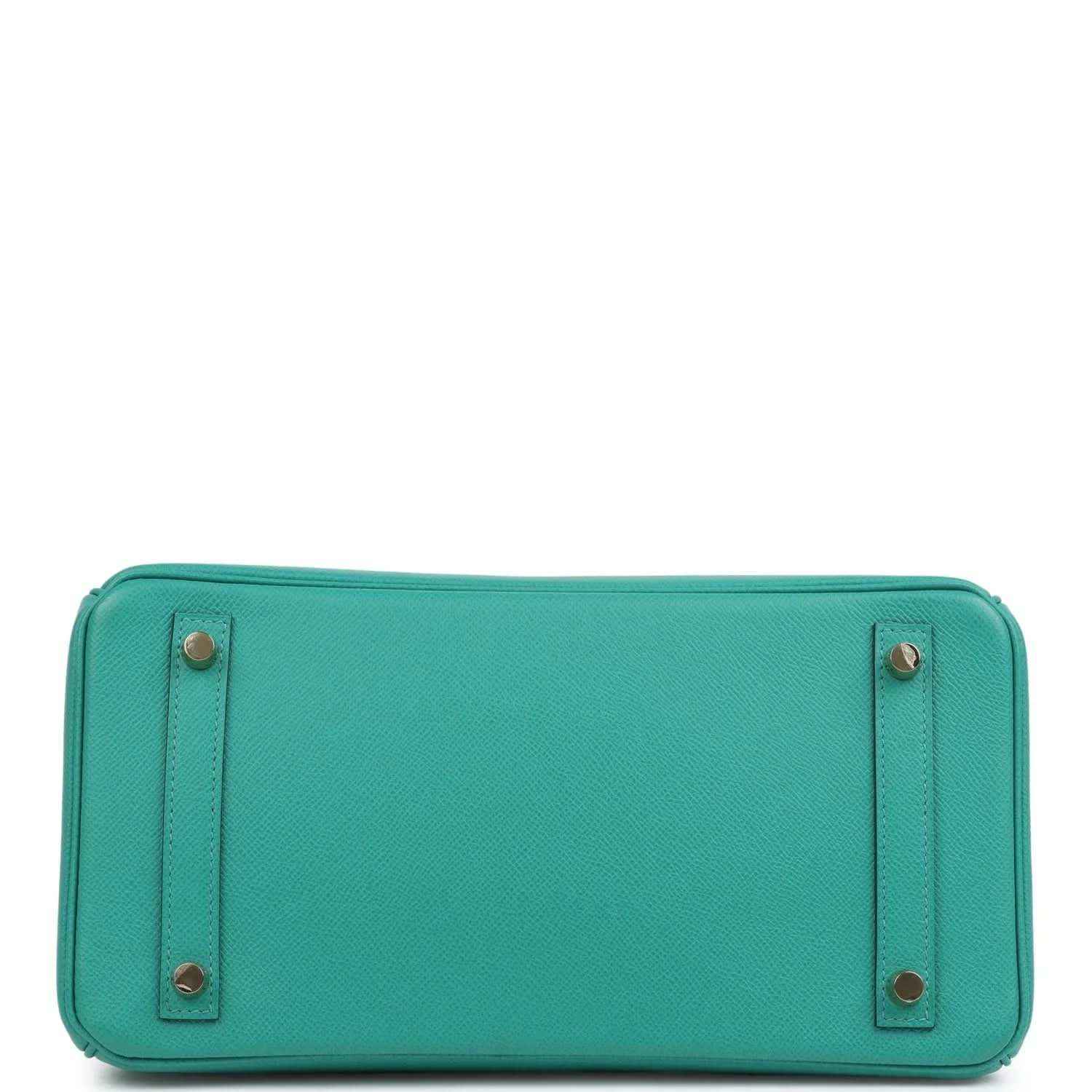 Timeless turquoise leather handbag base with gold-tone feet, elegant and sophisticated finish.