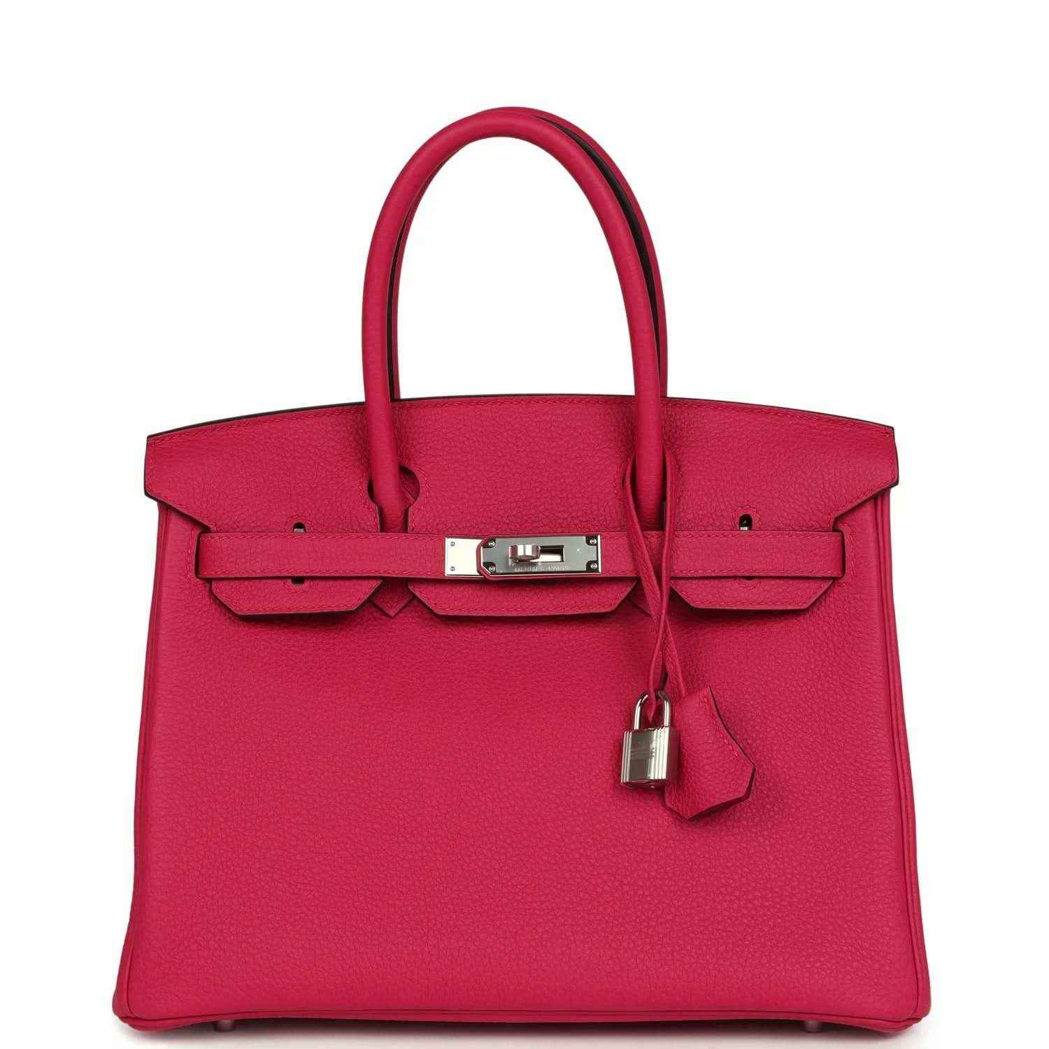 Elegant fuchsia leather handbag with silver hardware and a timeless, sophisticated design.