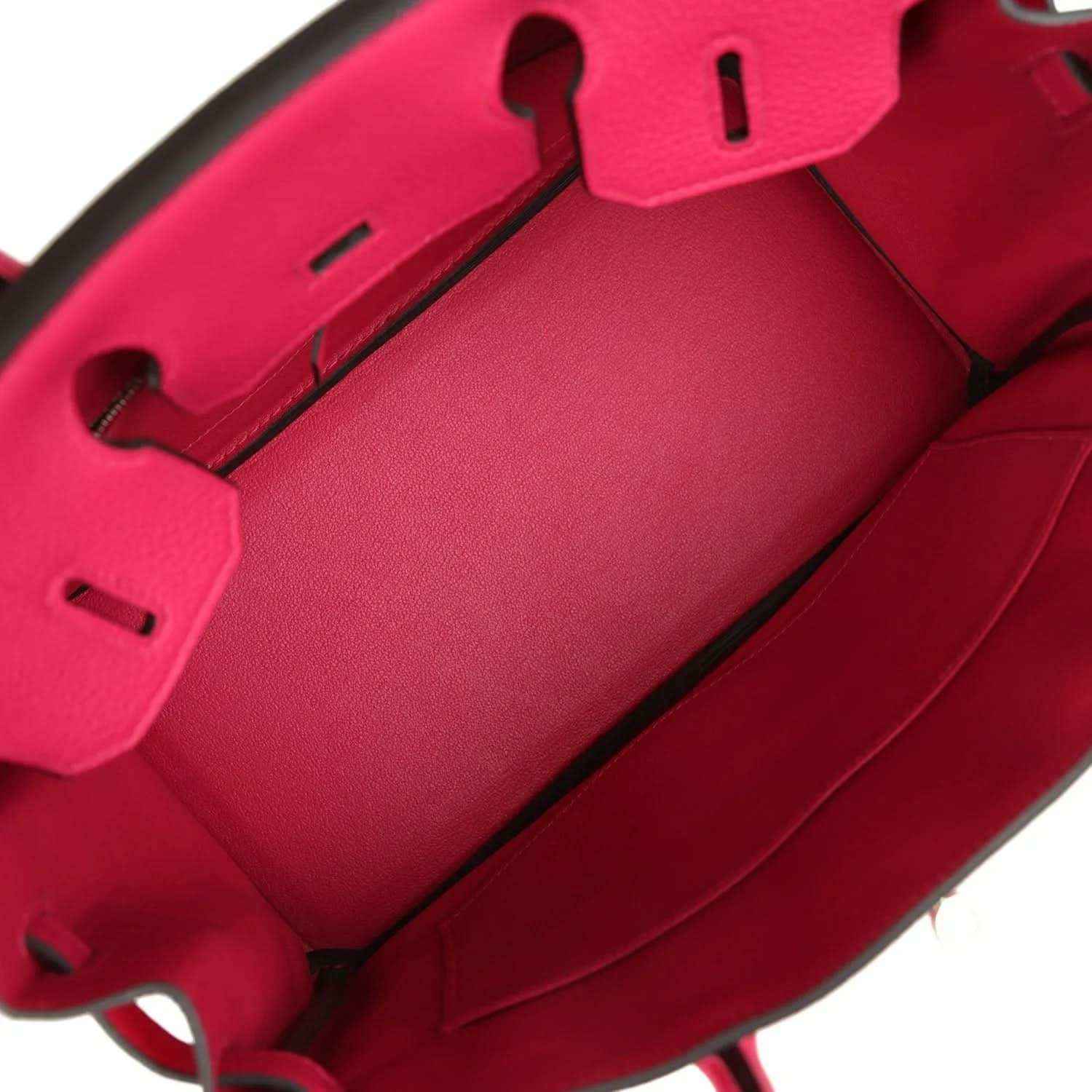 Elegant red leather handbag interior with refined, timeless design and sophisticated finish.