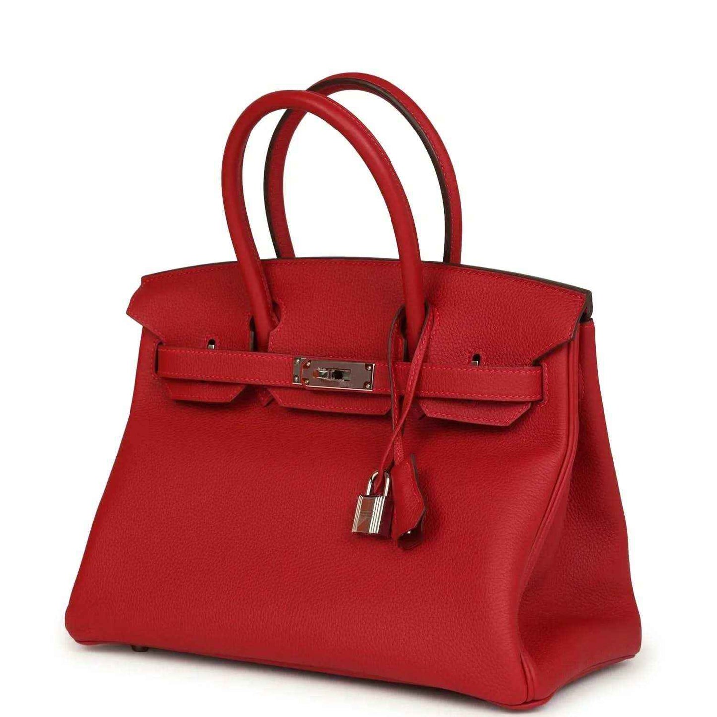 Elegant red leather handbag with silver hardware and structured, timeless design