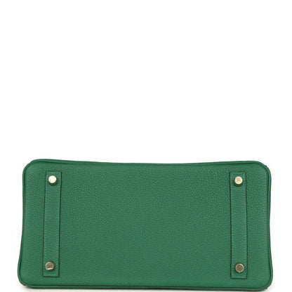 Timeless green leather handbag base with elegant gold feet and refined textured finish