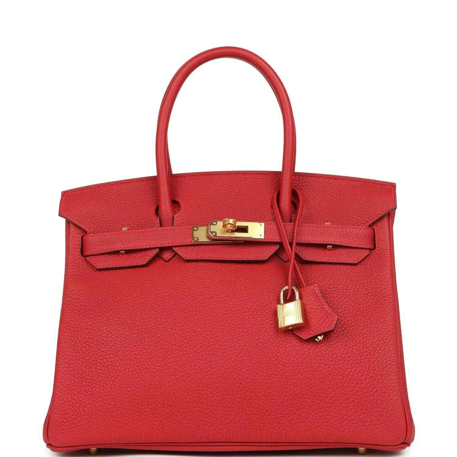 Elegant red leather handbag with gold hardware and a timeless, sophisticated design.