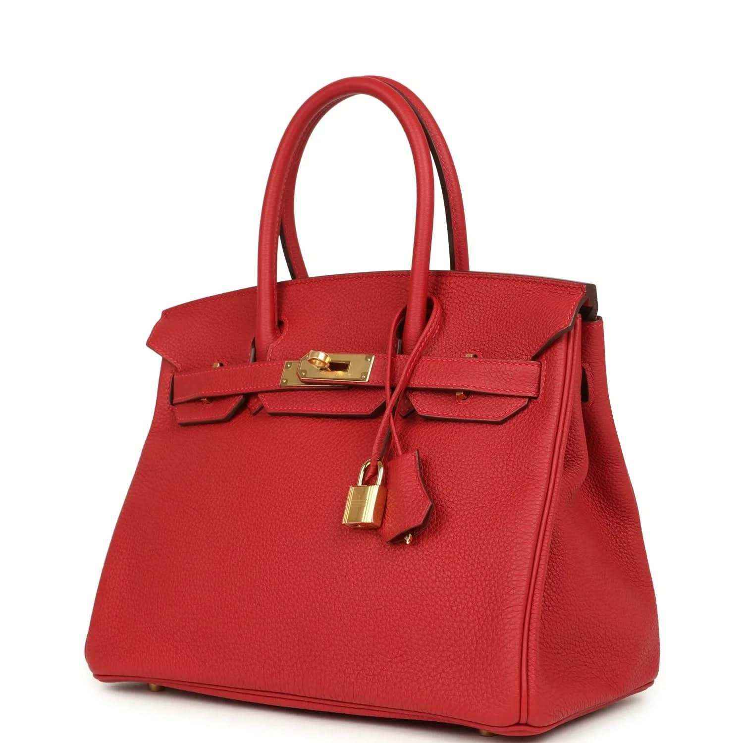 Elegant red leather handbag with gold hardware, showcasing timeless and sophisticated style