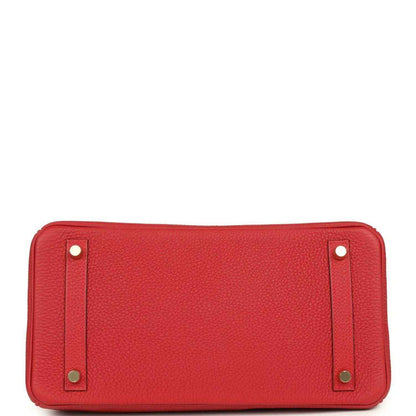 Timeless red leather handbag base with gold-tone stud accents, sophisticated and elegant.