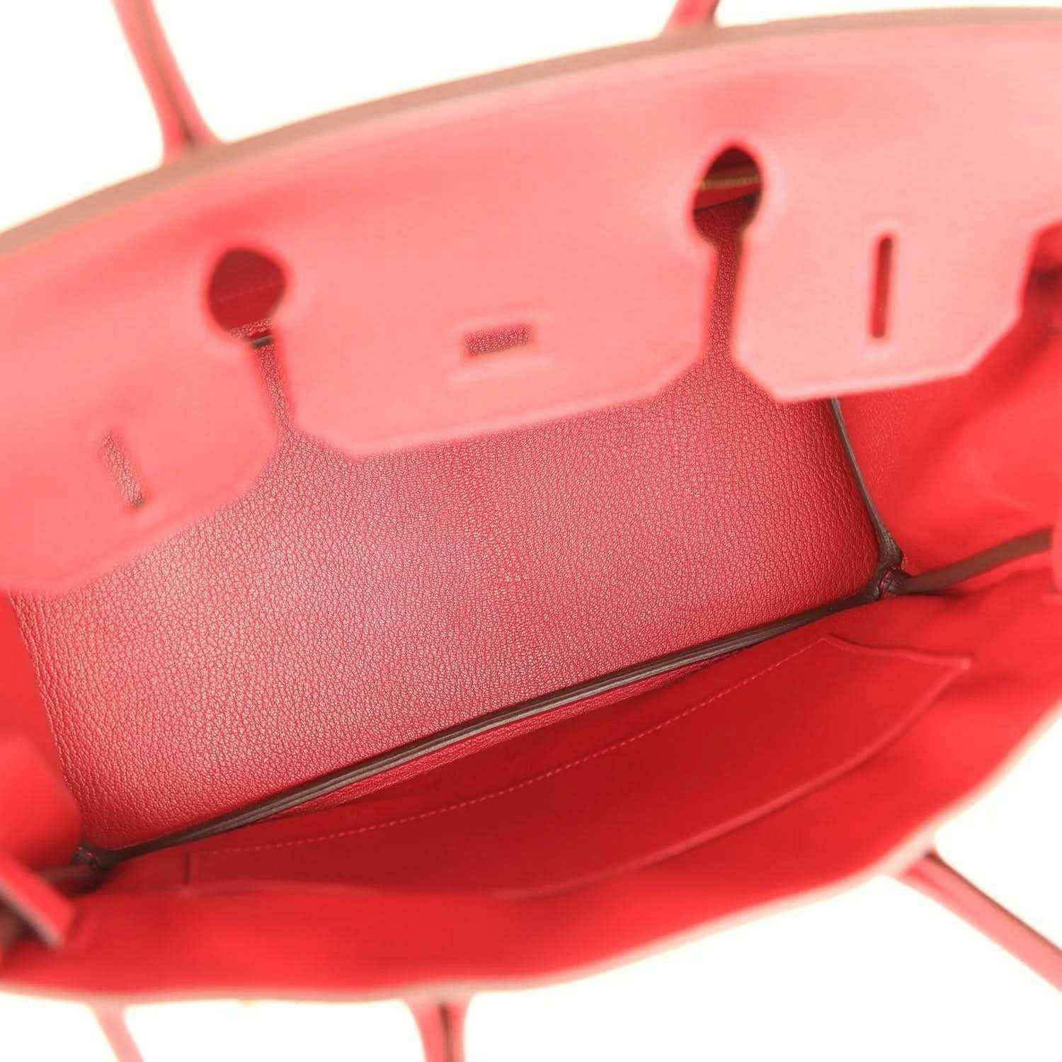 Elegant red leather handbag interior with timeless, sophisticated detailing
