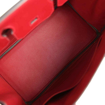 Timeless, elegant red leather handbag interior with refined, sophisticated detailing.