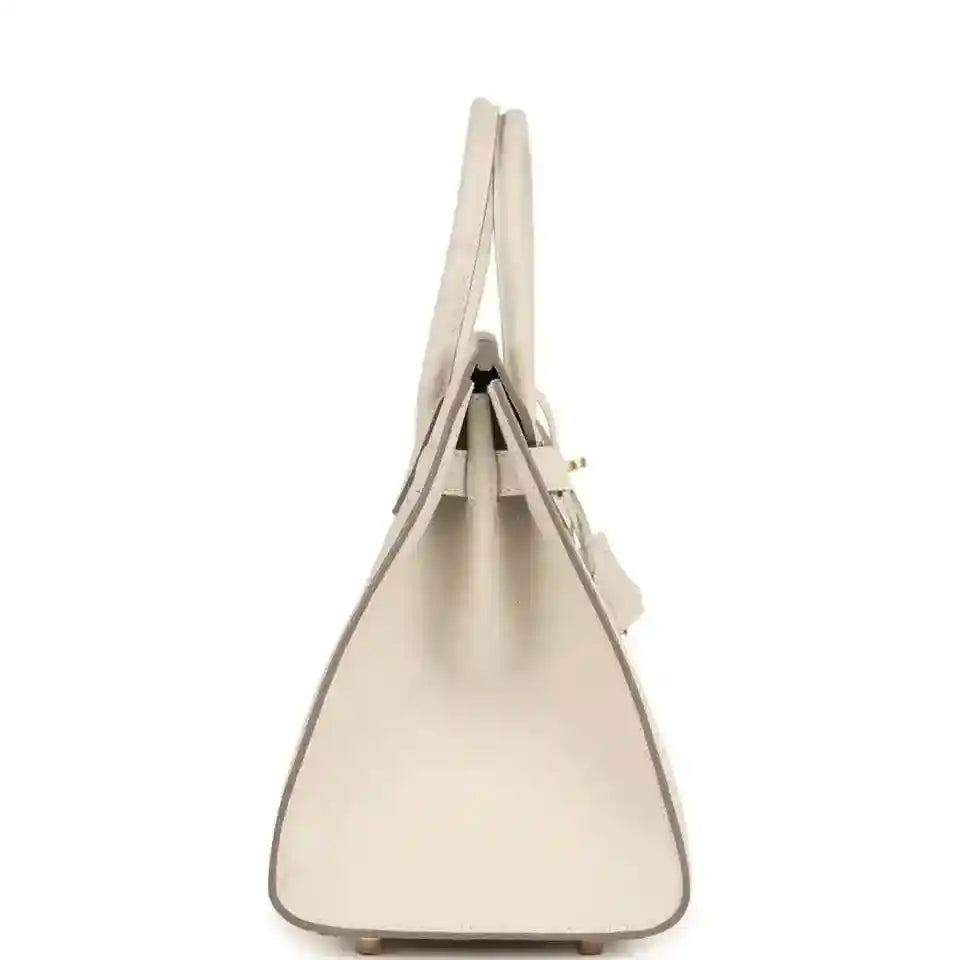 Elegant beige leather handbag with a structured, timeless silhouette and refined details