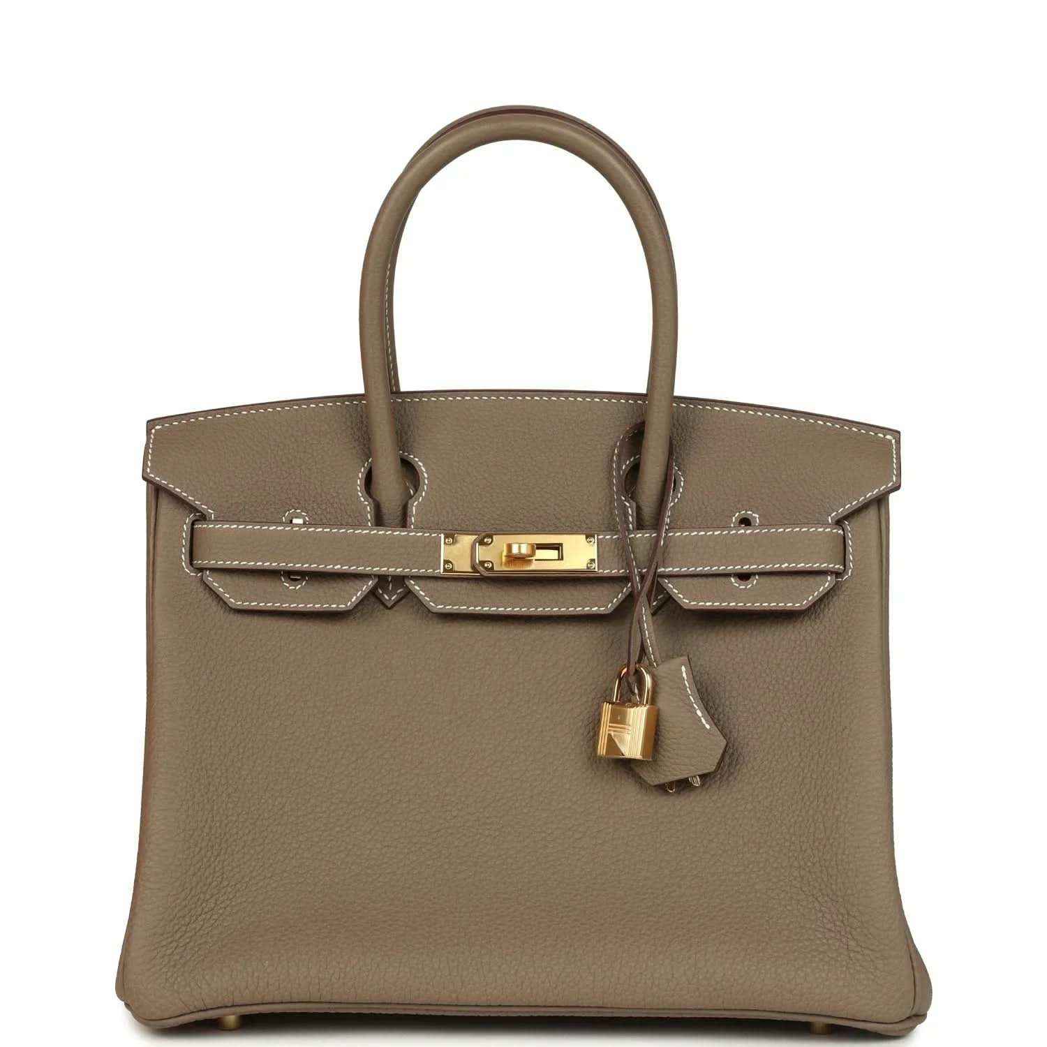 Timeless taupe leather handbag with gold hardware and elegant top handles.