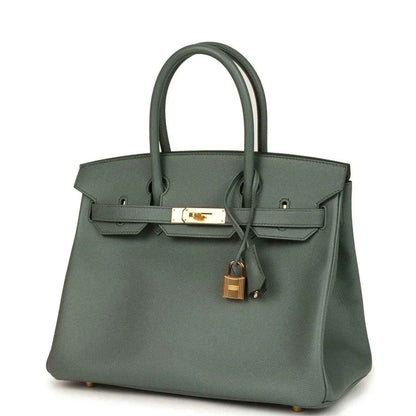 Timeless, sophisticated sage green leather handbag with elegant gold hardware accents.