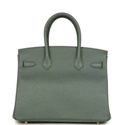 Timeless elegant sage green leather handbag with structured silhouette and double handles