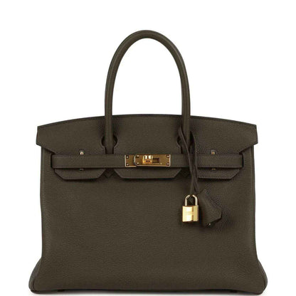 Timeless dark brown leather handbag with gold hardware, elegant and sophisticated style.