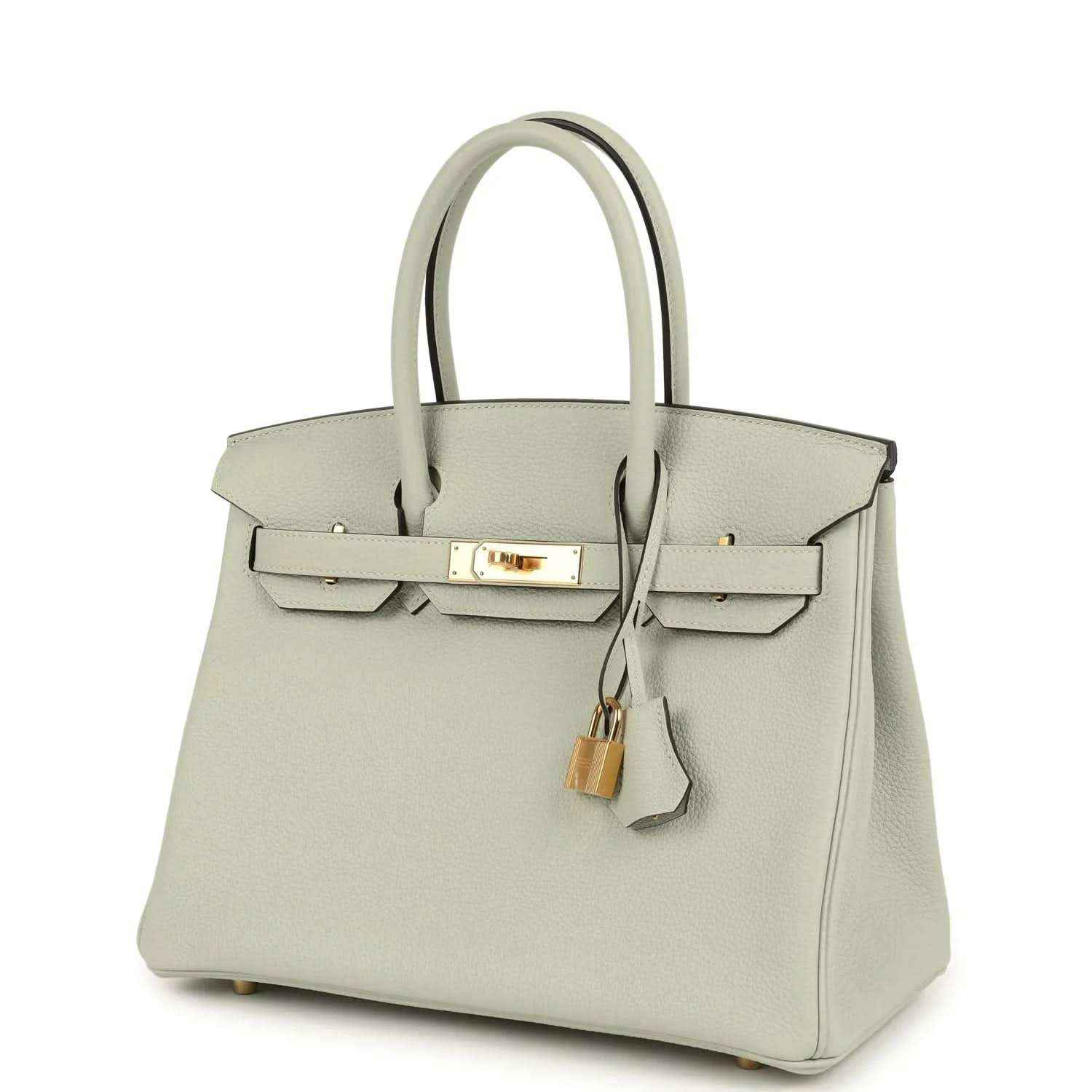 Elegant light grey leather handbag with gold hardware, timeless and sophisticated style.