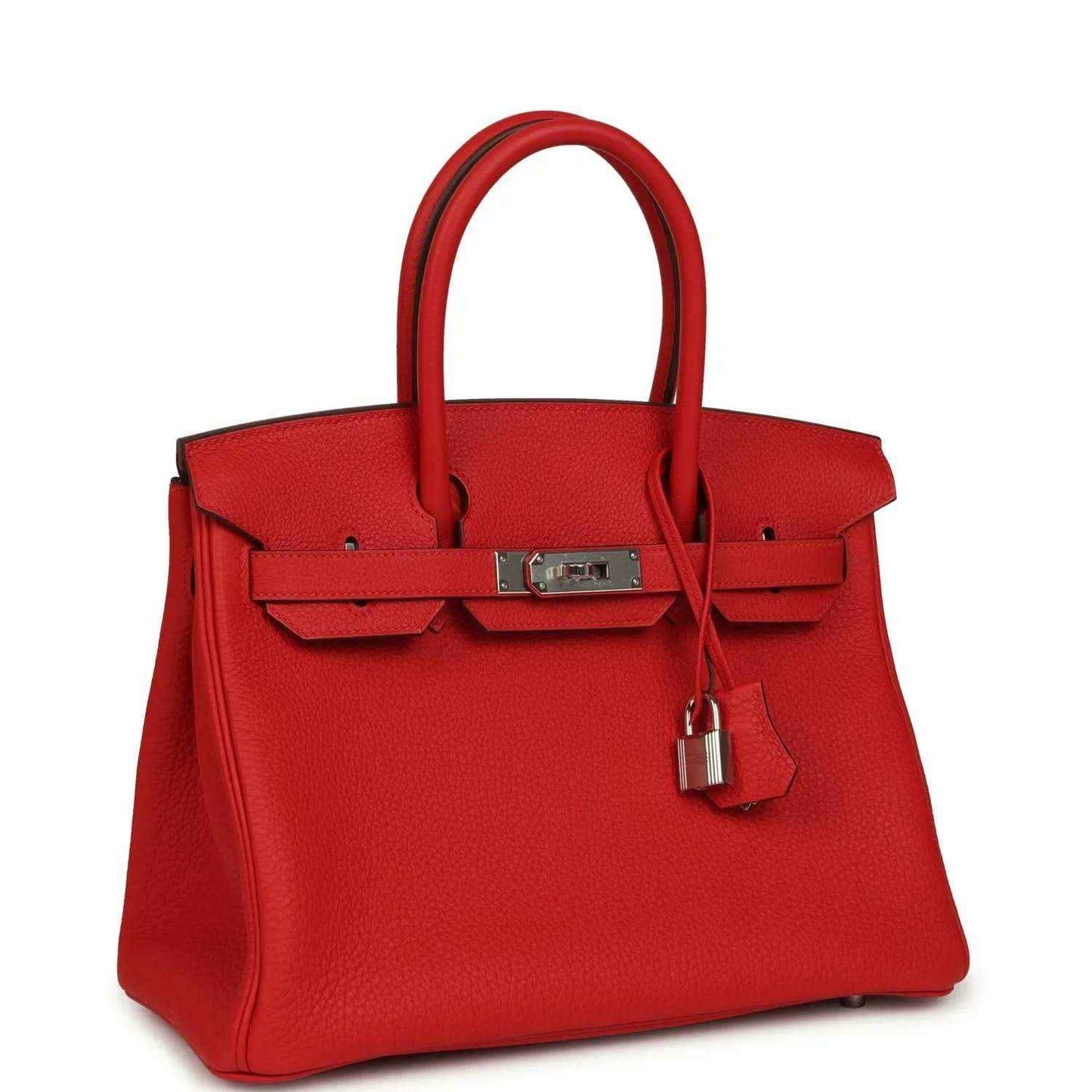 Elegant red leather handbag with silver hardware and top handles, timeless and sophisticated