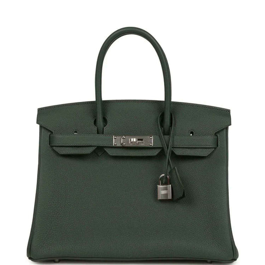 Timeless dark green leather handbag with silver hardware and elegant structured design