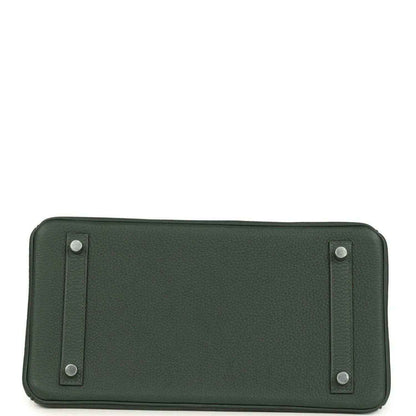 Timeless dark green leather handbag base with elegant silver-tone studs, sophisticated finish.