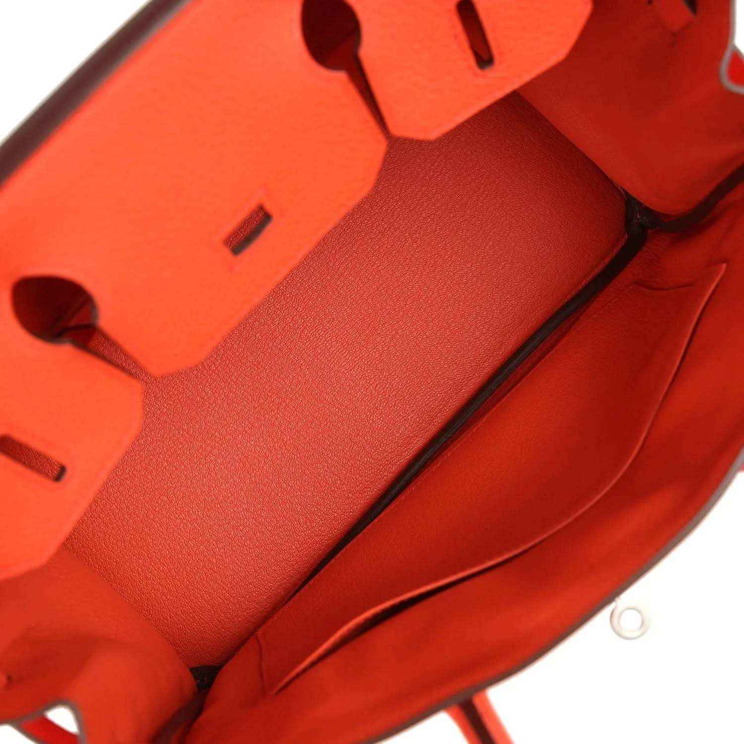 Timeless elegant red leather handbag interior with refined stitching and luxe finish.