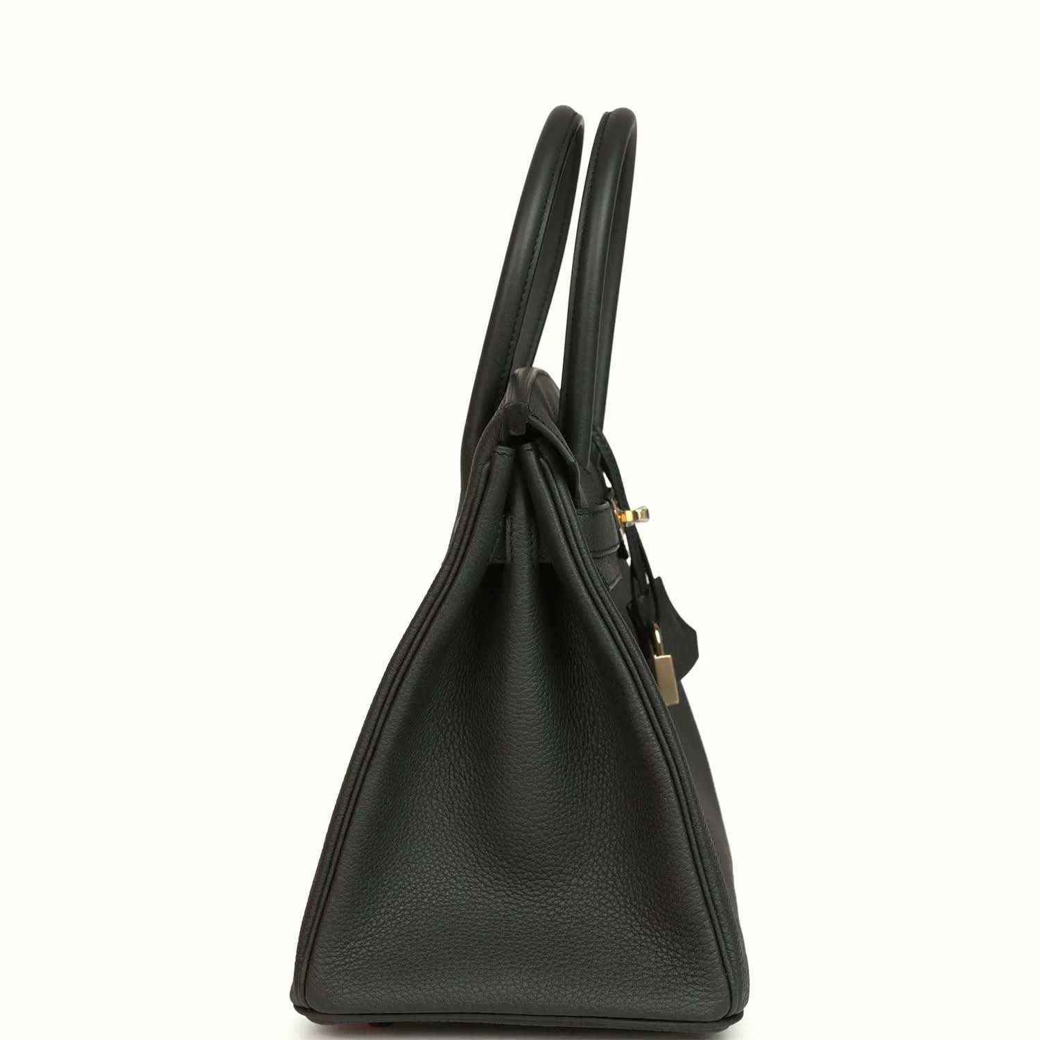Elegant black leather handbag with gold accents, featuring timeless and sophisticated design