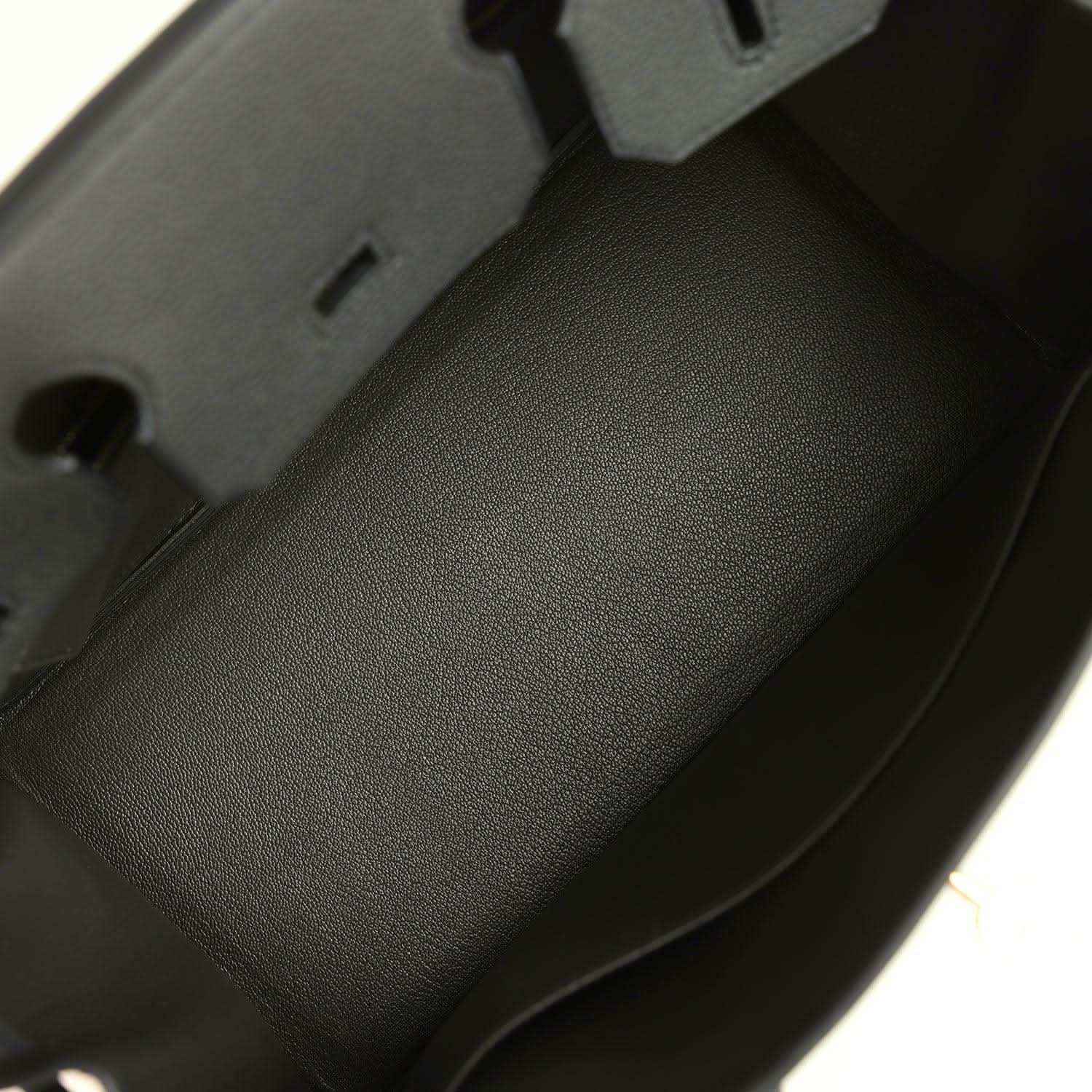 Timeless black leather handbag interior with smooth, elegant, high-quality finish.