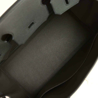 Timeless black leather handbag interior with smooth, elegant, high-quality finish.