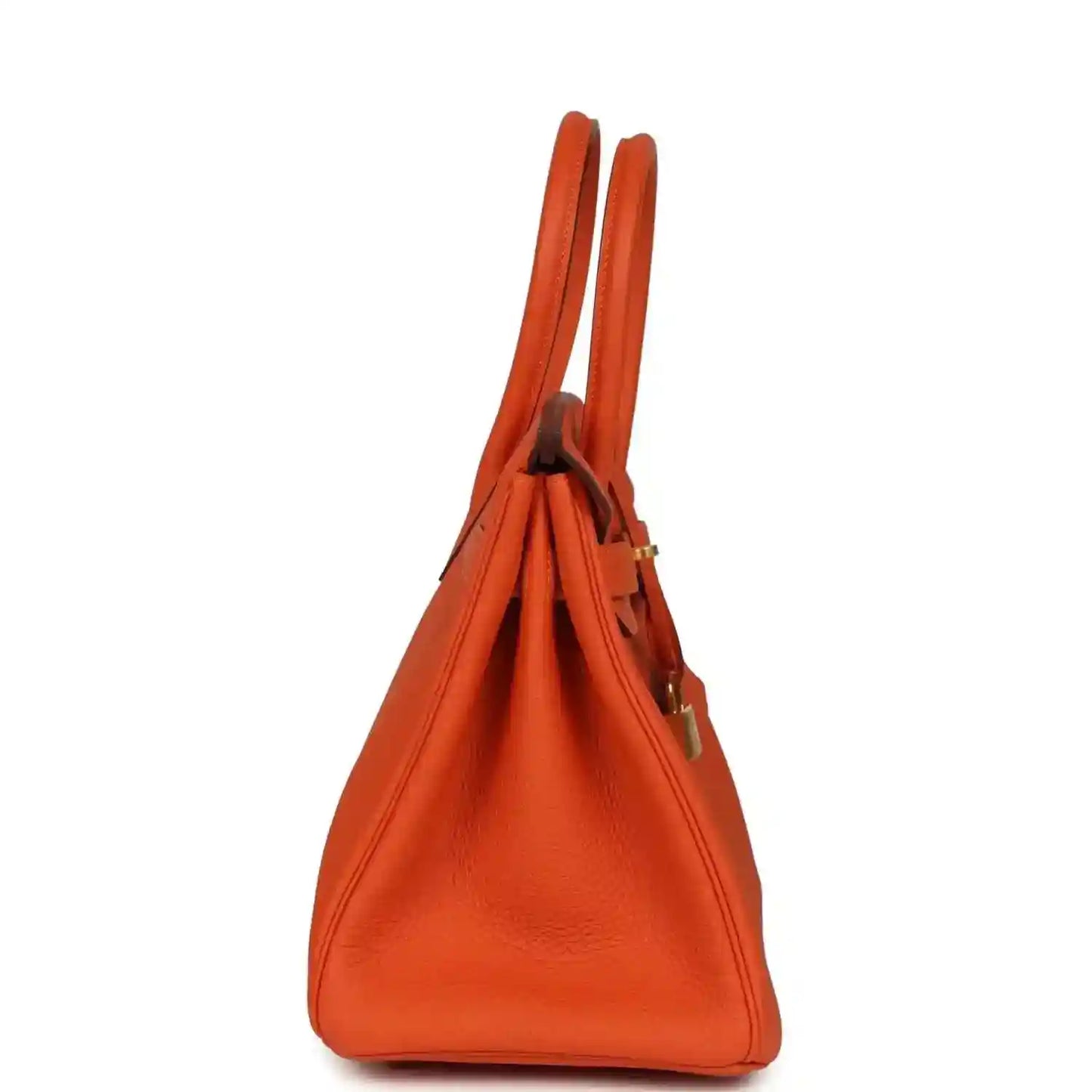 Elegant orange leather handbag with gold hardware, showcasing a timeless and sophisticated design