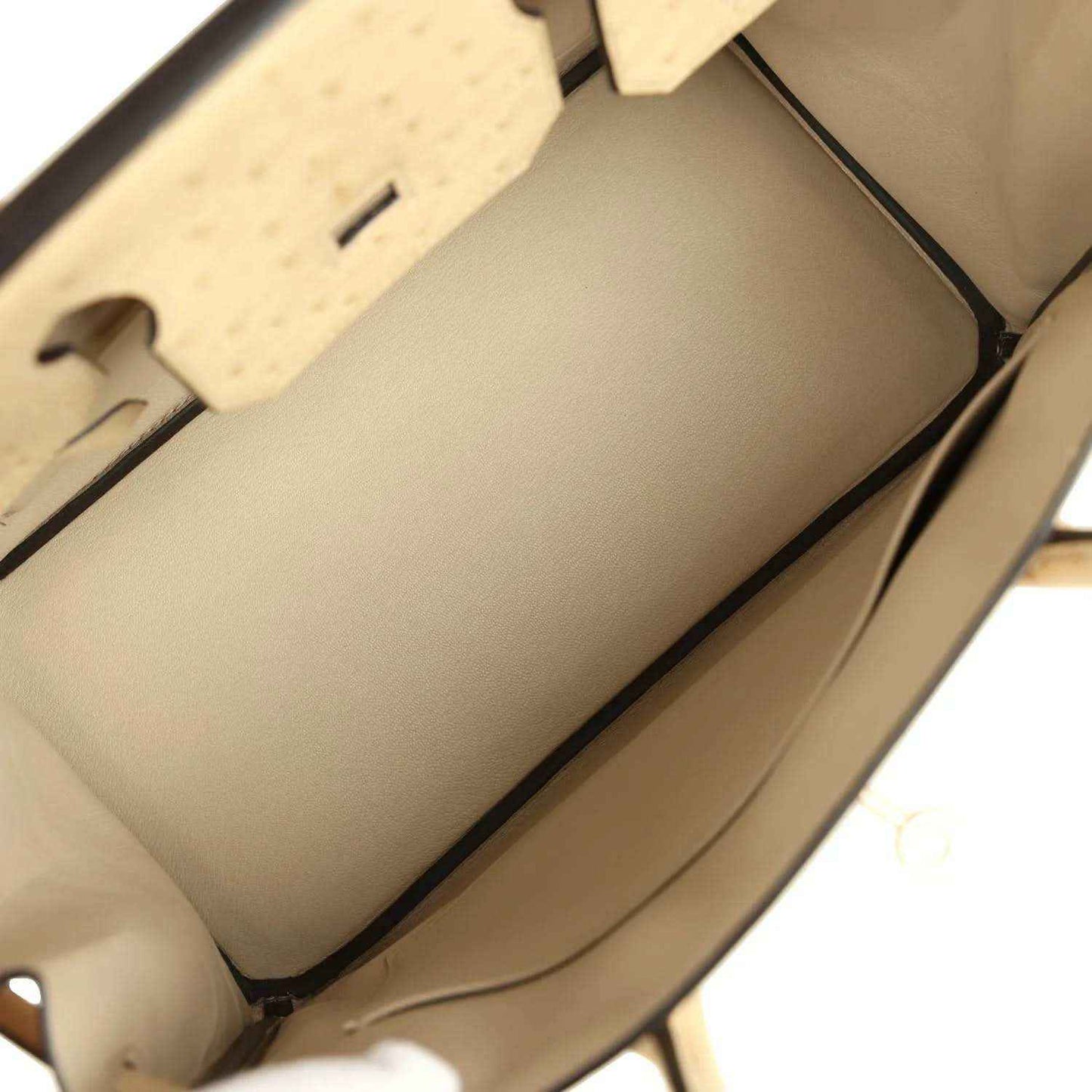 Elegant beige leather handbag interior with spacious, refined lining and sophisticated finish
